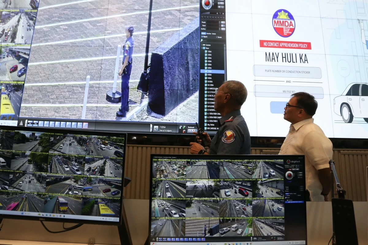'SAMPOL': PNP chief Gen. Nicolas Torre III and MMDA chairman Dion Artes show how the NCAP camera system could be used for police response during a press briefing at the MMDA command center in Pasig City on June 16, 2025. (Santi San Juan)