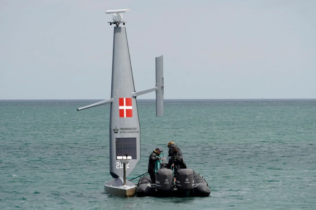 Workers deploy a Saildrone 
