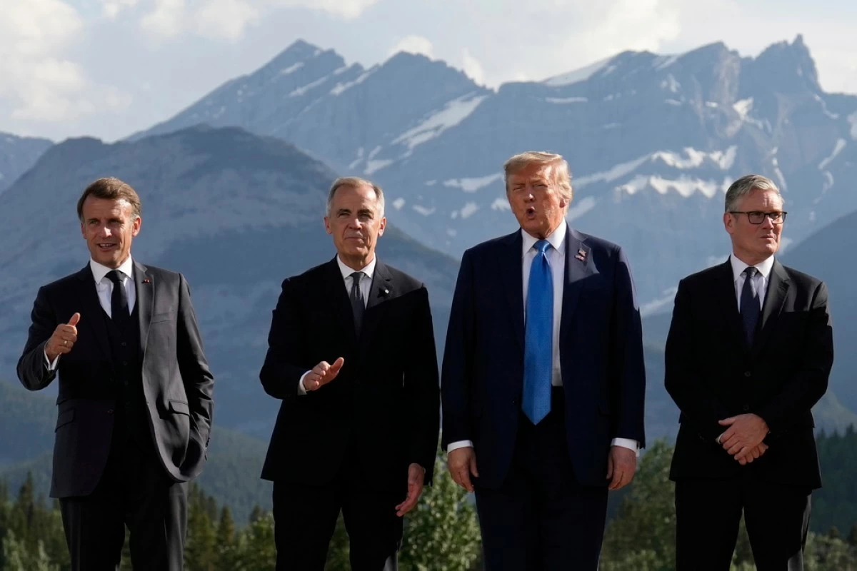 France's President Emmanuel Macron, Canada's Prime Minister Mark Carney, President Donald Trump and Britain's Prime Minister Keir Starmer, arrive for a group photo at the G7 Summit, Monday, June 16, 2025, in Kananaskis, Canada. (AP Photo/Mark Schiefelbein)