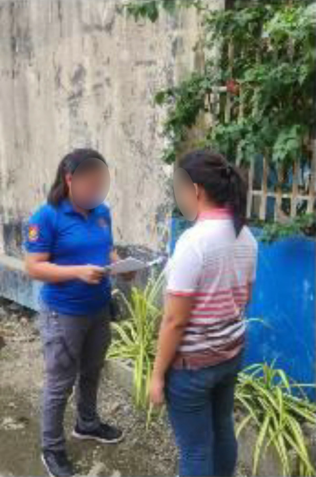 A CIDG operatives serves the arrest warrants against an alleged medical officer of the CPP-NPA wanted for various cases that include the Philippine version of crimes against humanity during an operation in Malimono, Surigao del Norte. (photo: CIDG) 