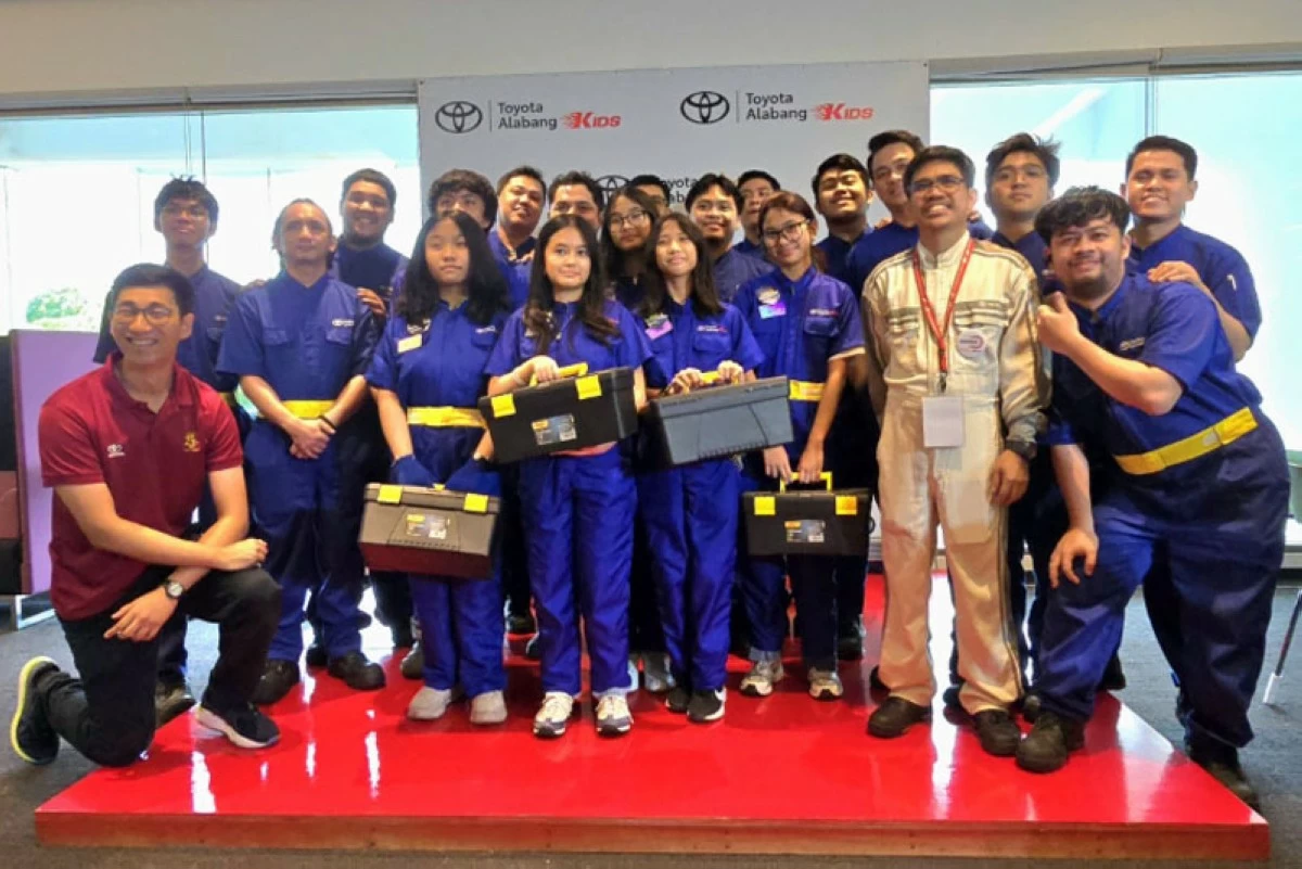 The Toyota Kids Tech participants clad in their overalls and carrying their tools.