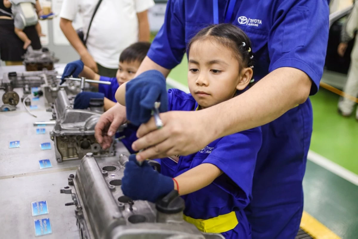 Little kids will always get a helping hand from supervising technicians to loosen the tightest bolts.