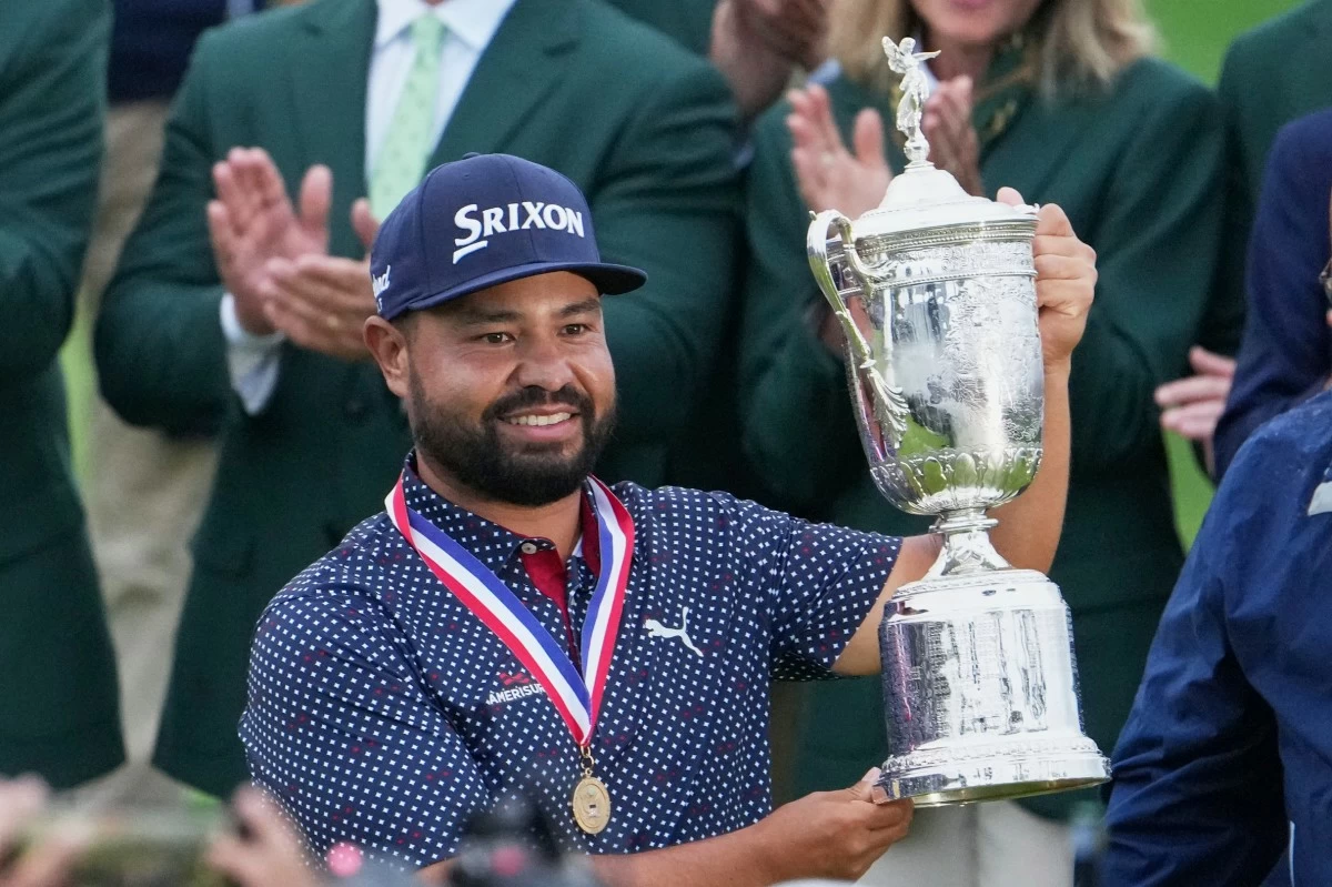 J.J. Spaun celebrates with the trophy after winning the U.S. Open golf tournament at Oakmont Country Club Sunday, June 15, 2025, in Oakmont, Pa. (AP Photo/Gene J. Puskar)