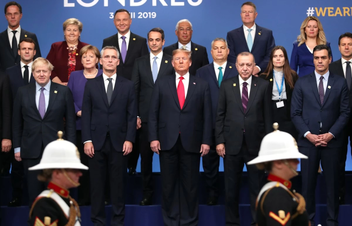 FILE - In this Dec. 4, 2019, photo, from front row left, British Prime Minister Boris Johnson, NATO Secretary General Jens Stoltenberg, U.S. President Donald Trump, Turkish President Recep Tayyip Erdogan and Spanish Prime Minister Pedro Sanchez attend a ceremony event during a NATO leaders meeting at The Grove hotel and resort in Watford, Hertfordshire, England. (AP Photo/Francisco Seco, File)