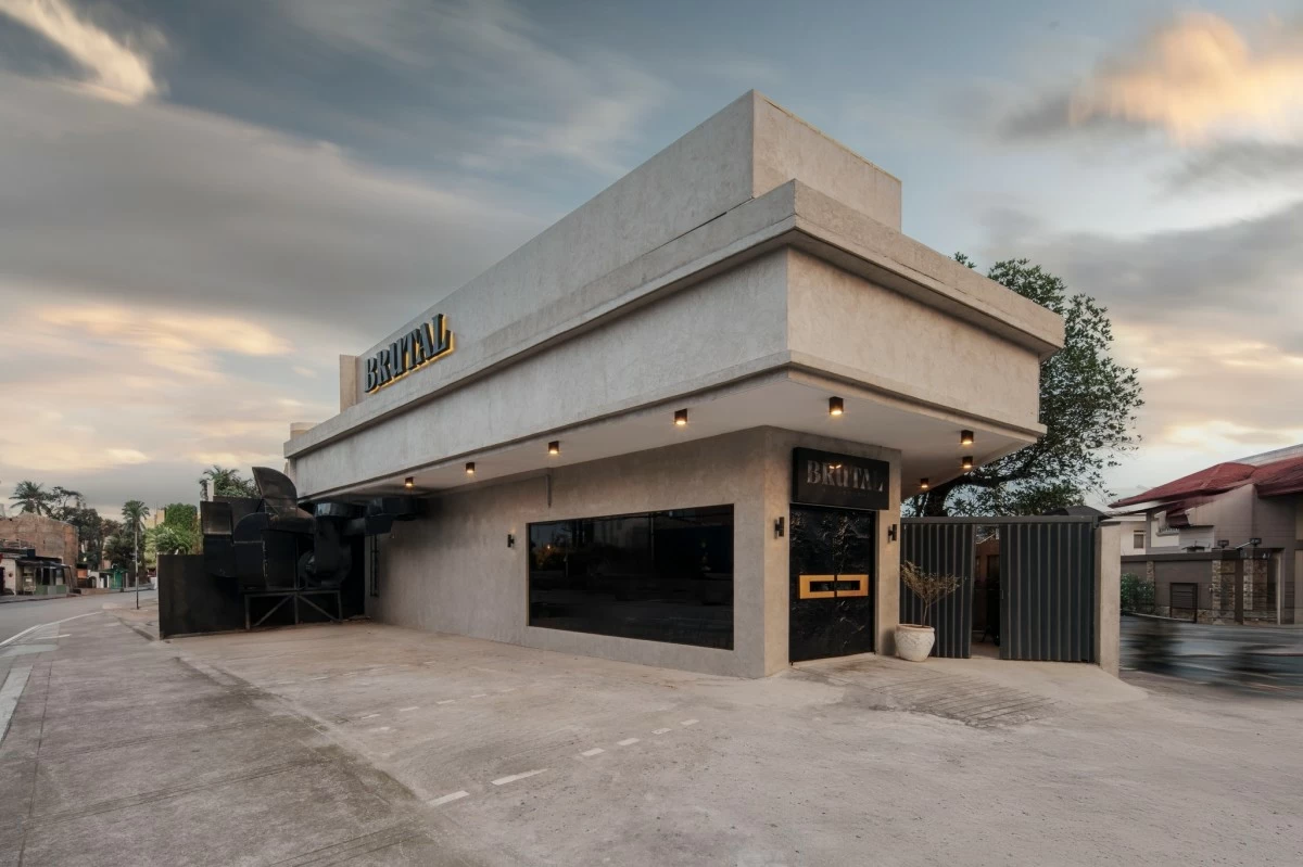 BRUTAL BEAUTY The unadorned concrete facade of Brutal by Wadough’s reflects its namesake, embracing a raw, brutalist aesthetic that mirrors the restaurant’s focus on stripped-down, thoughtful dining