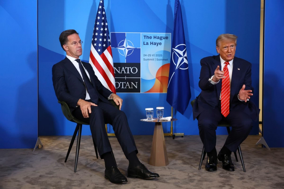 President Donald Trump, right, speaks during a meeting with NATO Secretary General Mark Rutte as he arrives for a NATO summit in The Hague, Netherlands, Wednesday, June 25, 2025. (Piroschka van de Wouw, Pool Photo via AP)