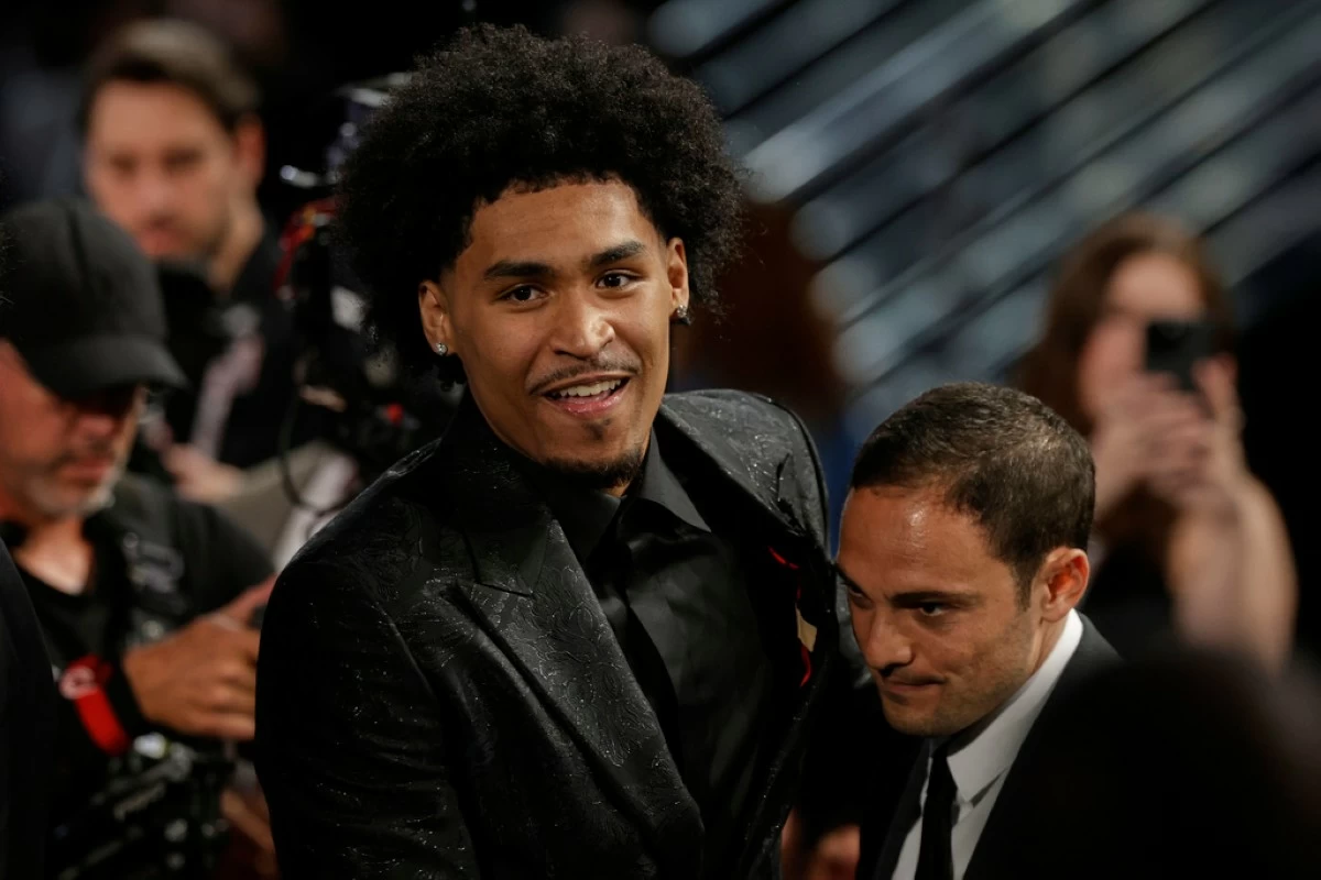 Dylan Harper reacts after being selected second by the San Antonio Spurs In the first round of the NBA basketball draft, Wednesday, June 25, 2025, in New York. (AP Photo/Adam Hunger)