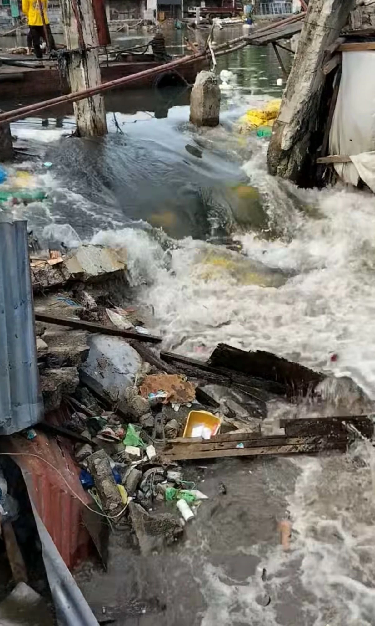 The damaged sandbags at the Navotas river wall on Sunday, June 29. (Navotas Disaster Risk Reduction and Management Office facebook page)