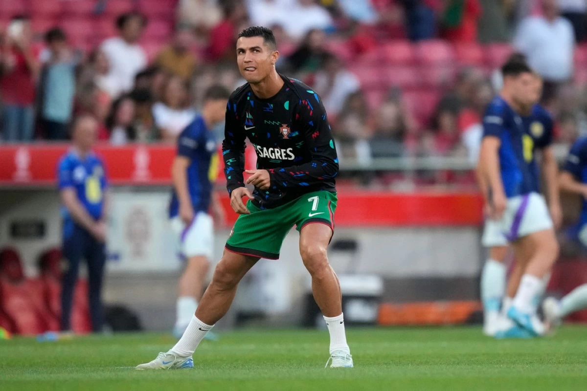Portugal's Cristiano Ronaldo warms up before the UEFA Nations League soccer match between Portugal and Scotland at the Luz stadium in Lisbon, Portugal, Sunday, Sept. 8, 2024. (AP Photo/Armando Franca)