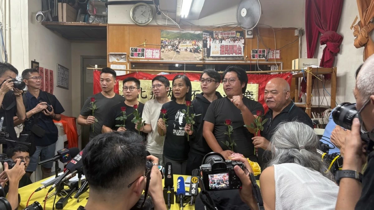 Current and former members of Hong Kong's pro-democracy political party, the League of Social Democrats, speak at a press conference, in Hong Kong, Sunday, June 29, 2025. (AP Photo/Kanis Leung)
