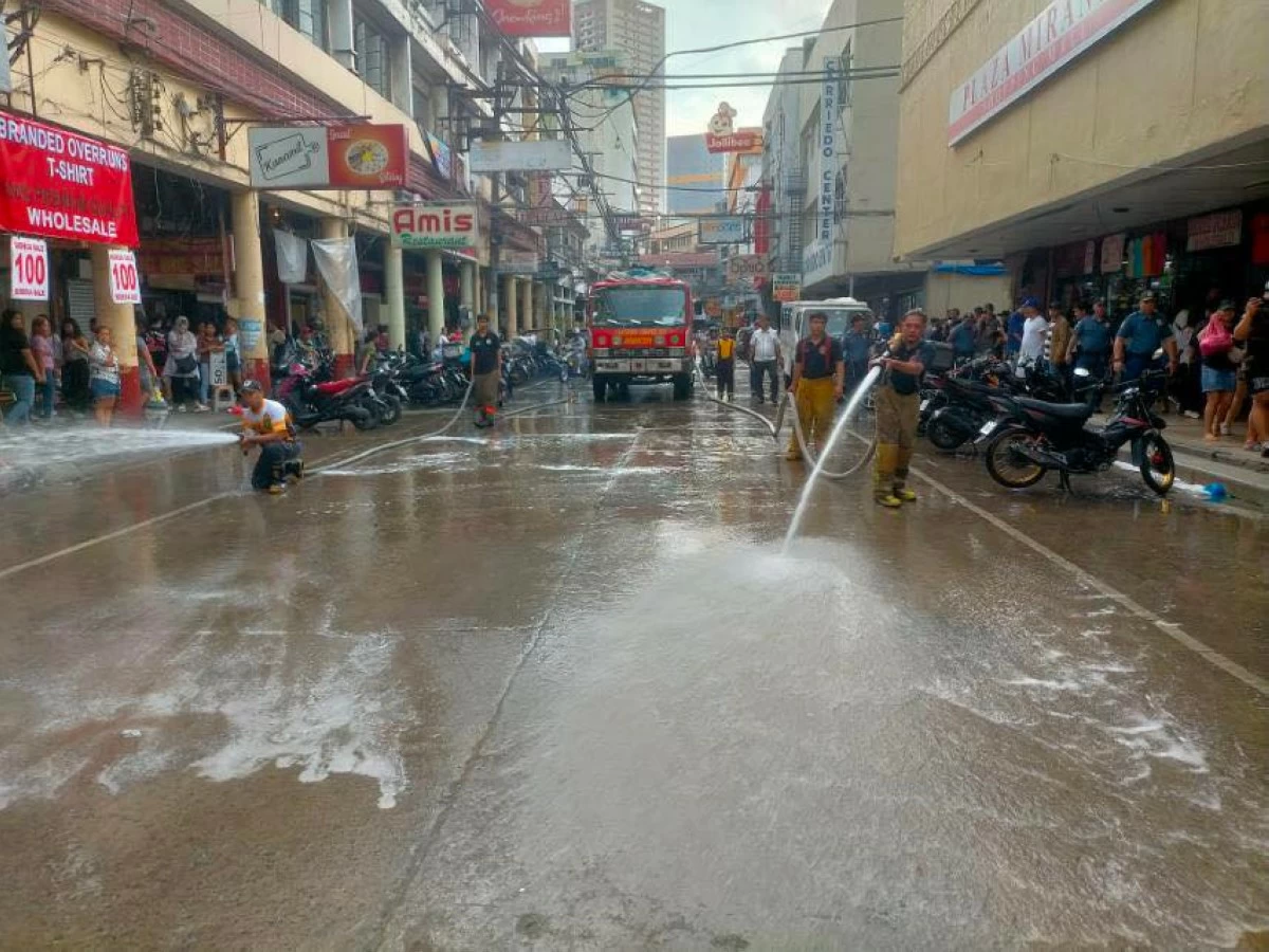 THOROUGH HOUSE CLEANING - Flushing and cleaning operations in the City of Manila characterized the first day in office of Mayor Francisco 