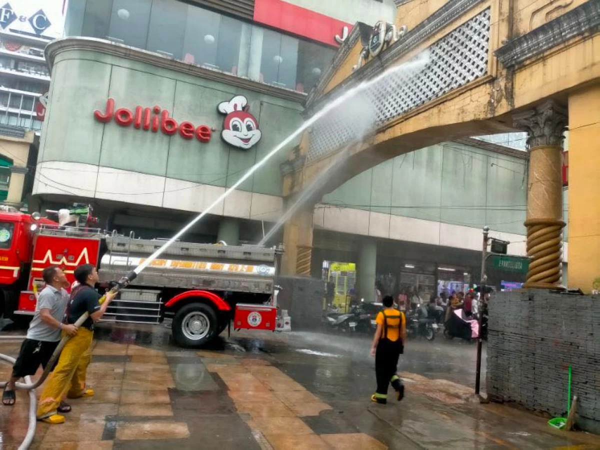 THOROUGH HOUSE CLEANING - Flushing and cleaning operations in the City of Manila characterized the first day in office of Mayor Francisco 