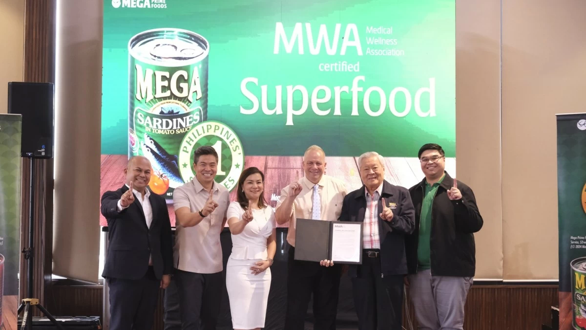 Mega Prime Foods, Inc. Chairman Emeritus William Tiu Lim receives certificate of recognition from Medical Wellness Association Board Member James Michael Lafferty with Mega Prime Foods, Inc. Vice President of Marketing Albet Buddahim, Chief of Growth and Development Marvin Tiu Lim, President and CEO Michelle Tiu Lim-Chan, and Group Category Head (Seafood) Mark Henry Camacho