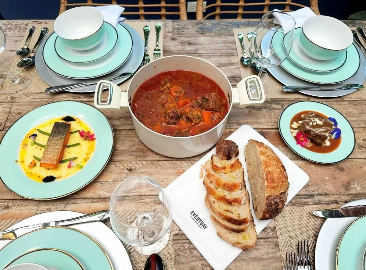 HEARTY DISPLAY Table setting with the Braised Beef Stew in the Dutch Oven (center) and Pan Fried Salmon (left)
