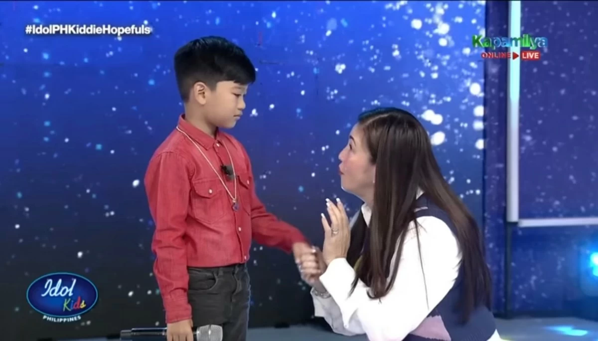 Kiddie hopeful Liam with Regine