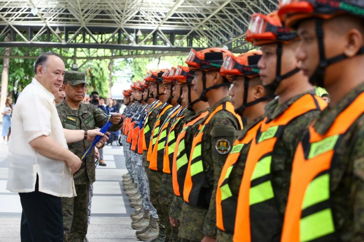 Department of National Defense (DND) Secretary Gilberto Teodoro Jr. and Armed Forces chief General Romeo Brawner Jr. lead the awarding of the Philippine Inter-Agency Humanitarian Contingent (PIAHC) and the ASEAN Emergency Response and Assessment Team (ASEAN-ERAT) at Camp Aguinaldo in Quezon City on July 4, 2025. The contingents were deployed to Myanmar from April 1 to 13 for a humanitarian mission in the aftermath of a magnitude 7.7 earthquake that struck central Myanmar on March 28. (Photo: AFP)