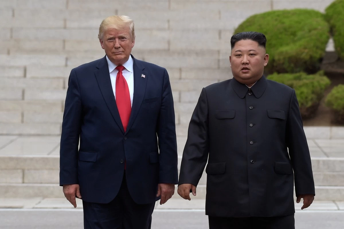 FILE - President Donald Trump, left, meets with North Korean leader Kim Jong Un at the North Korean side of the border at the village of Panmunjom in Demilitarized Zone, June 30, 2019. (AP Photo/Susan Walsh, File)