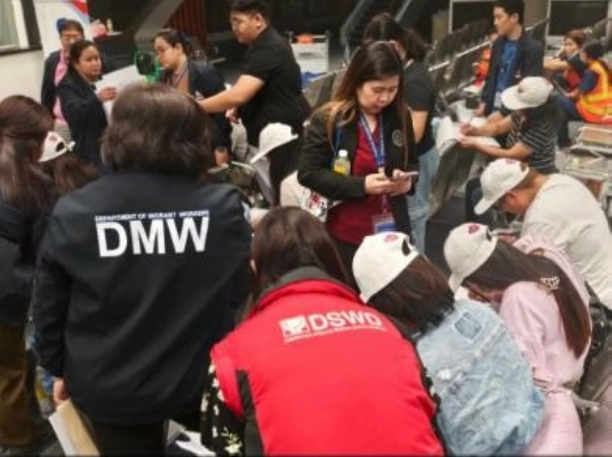 Personnel from DMW and other government agencies assist the 13 OFWS who arrived at the NAIA Terminal 1 in Pasay City on Friday, July 4, 2025 amid the ongoing repatriation for Filipinos in the Middle East despite the improvement of the security situation between Iran and Israel. (photo: DMW) 