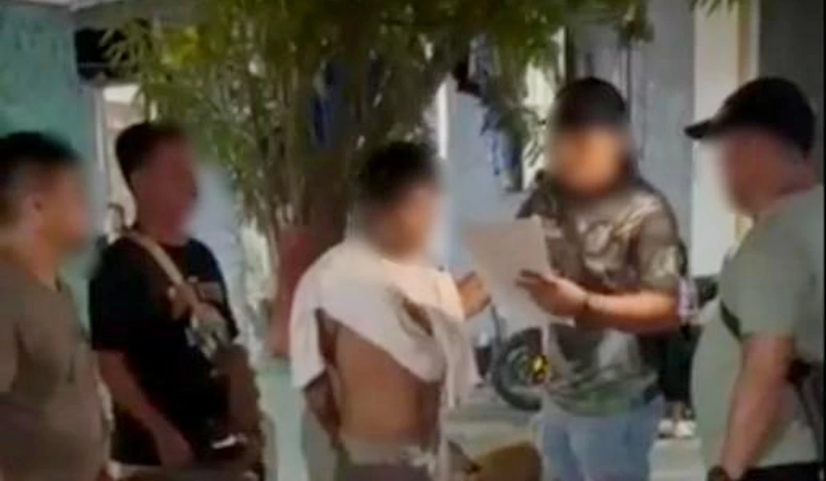 The Taguig police with the accused (Photo from Taguig police / SPD)