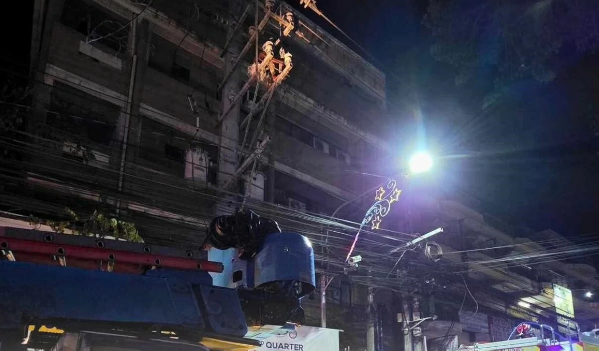 The man who climbed a Meralco post in Muntinlupa on July 5 (Photo from the Muntinlupa City Department of Disaster Resilience and Management)