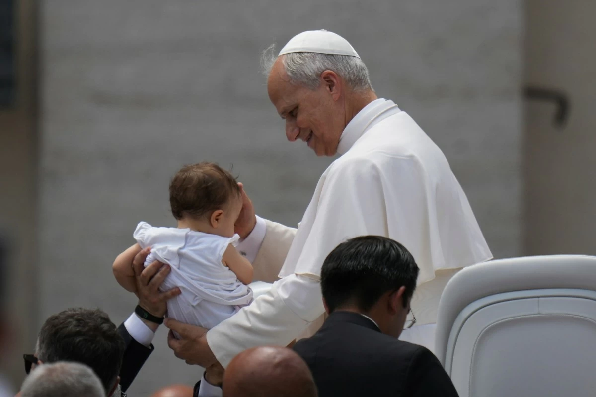 Pope Leo XIV leaves at the end of his weekly general audience in St. Peter's Square at the Vatican, Wednesday, June 18, 2025. (AP Photo/Alessandra Tarantino)