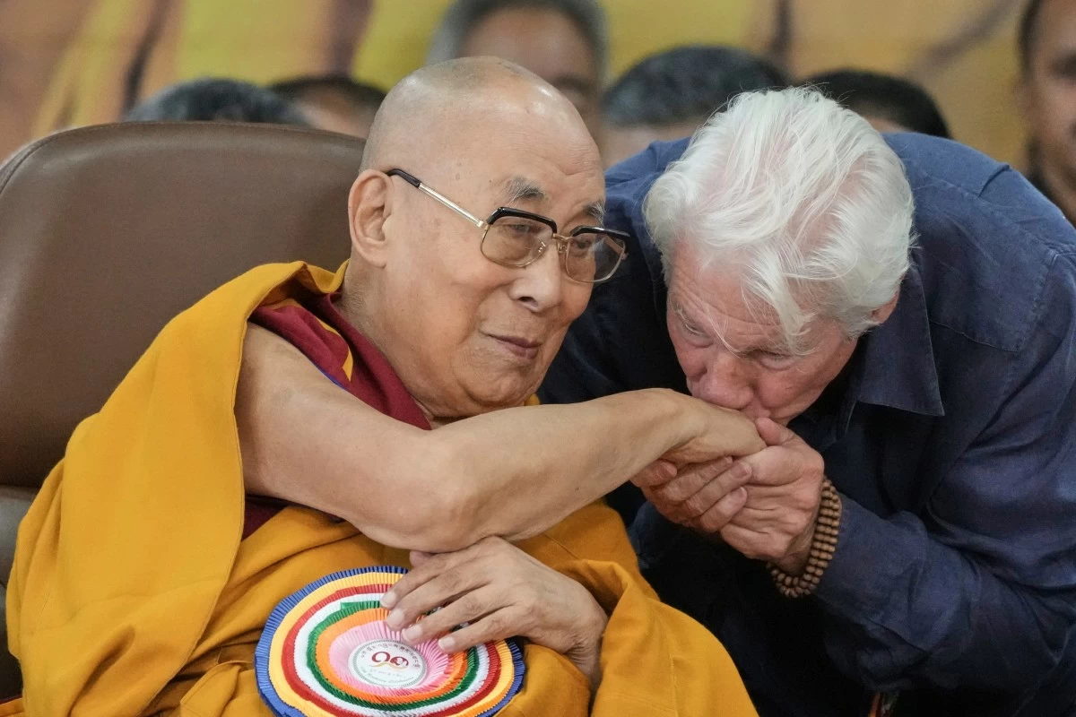 ACTOR Richard Gere (right) kisses the hand of Tibetan spiritual leader the Dalai Lama at an event celebrating the Dalai Lama's 90th birthday in Dharamshala, India, Sunday, July 6, 2025. (AP)