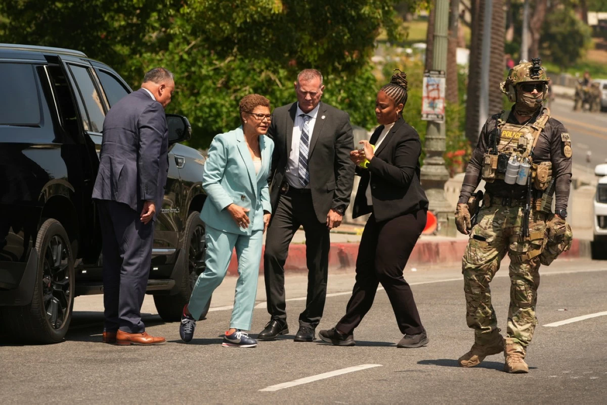 Los Angeles Mayor Karen Bass arrives at MacArthur Park, where federal agents were staging, Monday, July 7, 2025, in Los Angeles. (AP Photo/Damian Dovarganes)