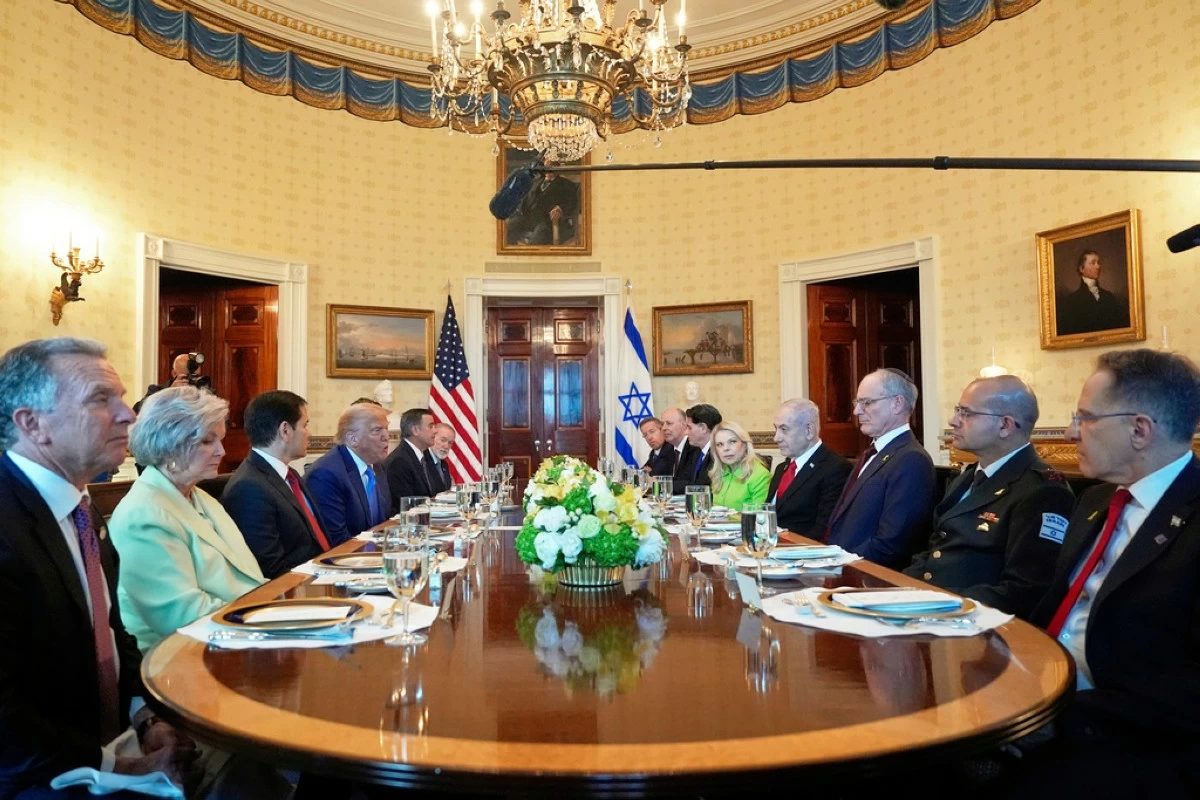 President Donald Trump, fourth from left, meets with Israel's Prime Minister Benjamin Netanyahu, fourth from right, as White House special envoy Steve Witkoff, from left, White House Chief of Staff Susie Wiles, Secretary of State Marco Rubio, Defense Secretary Pete Hegseth, obstructed, CIA Director John Ratcliffe and U.S. Ambassador to Israel Mike Huckabee listen in the Blue Room of the White House, Monday, July 7, 2025, in Washington. (AP Photo/Alex Brandon)