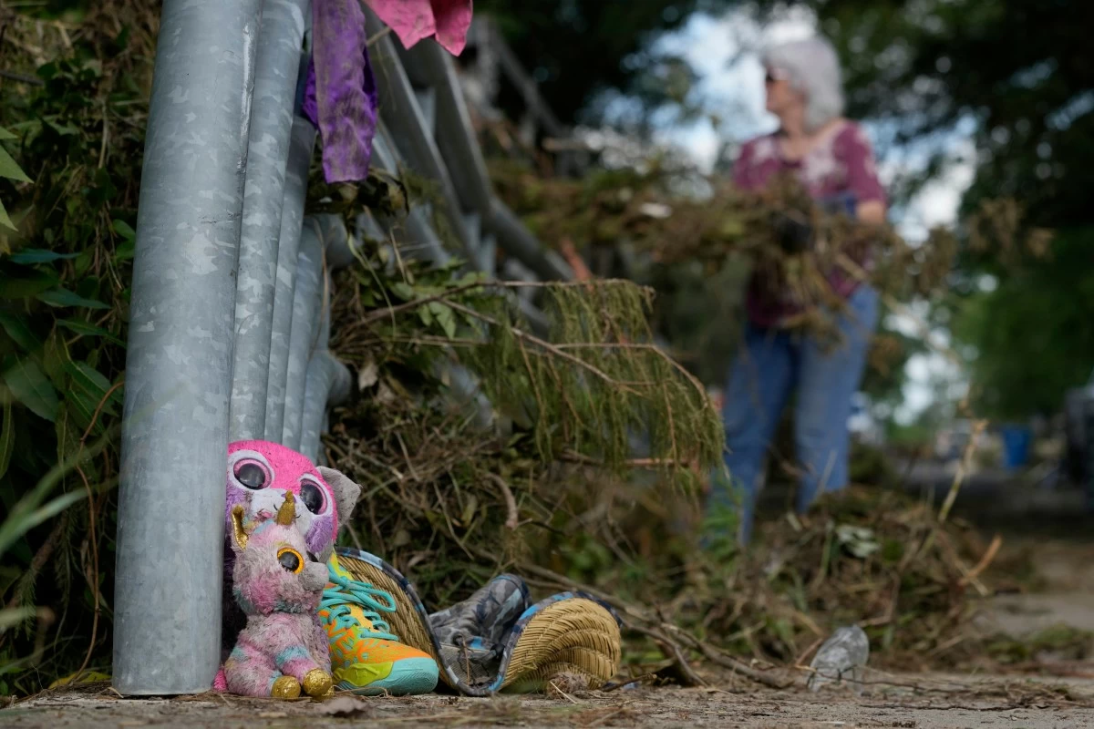 LOST items sit on a bridge as a volunteer cleans up debris on Tuesday, July 8, 2025, after a flash flood swept through the area in Kerrville, Texas. (AP)