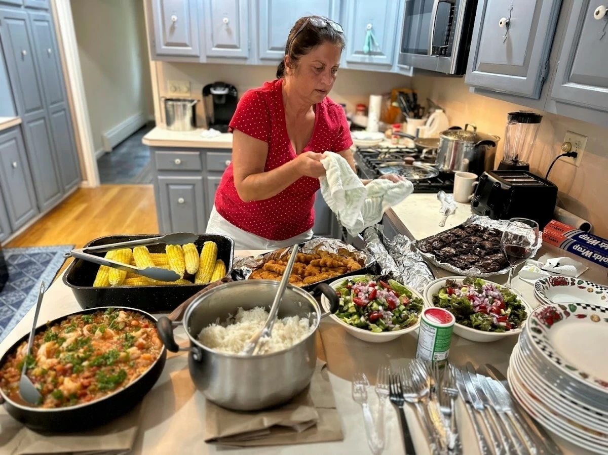 IN this undated photo provided by her daughter, Mandonna ‘Donna’ Kashanian, 64, prepares a meal. (Kaitlynn Milne via AP)