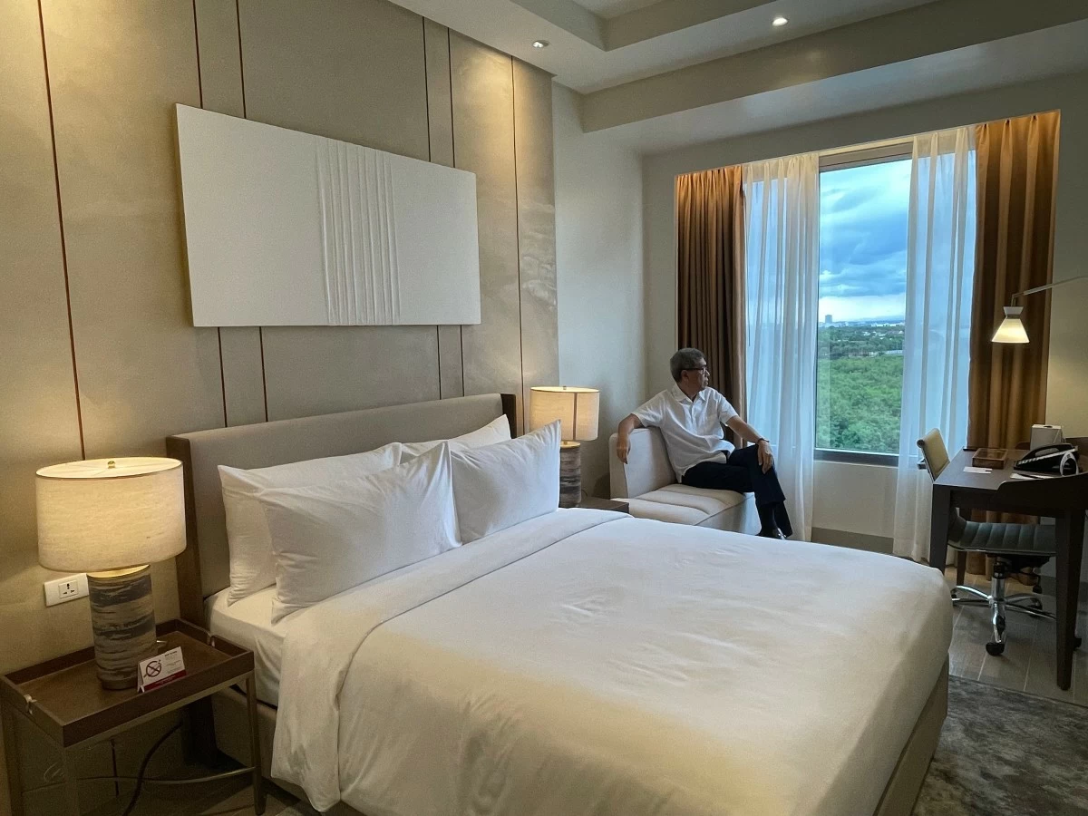 COMFORT IS BLISS The author enjoying the contemporary classic vibe at Grand Westside Hotel