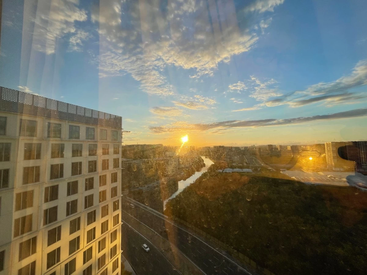 RISE AND SHINE Sun rising over the skyscraper city, as seen from Kingsford Hotel's West Wing room