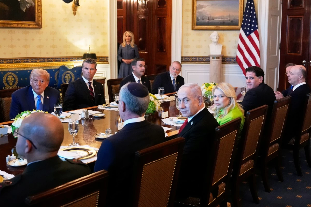 President Donald Trump, from back row left, Defense Secretary Pete Hegseth, CIA Director John Ratcliffe and U.S. Ambassador to Israel Mike Huckabee, meet with Israeli Ambassador to the U.S. Yechiel Leiter, front row from second left, Israel's Prime Minister Benjamin Netanyahu, Netanyahu's wife Sara Netanyahu, Israel's Strategic Affairs Minister Ron Dermer, Israel's National Security Council head Tzachi Hanegbi and Israel's Cabinet Secretary Yossi Fuchs in the Blue Room of the White House, Monday, July 7, 2025, in Washington. (AP Photo/Alex Brandon)
