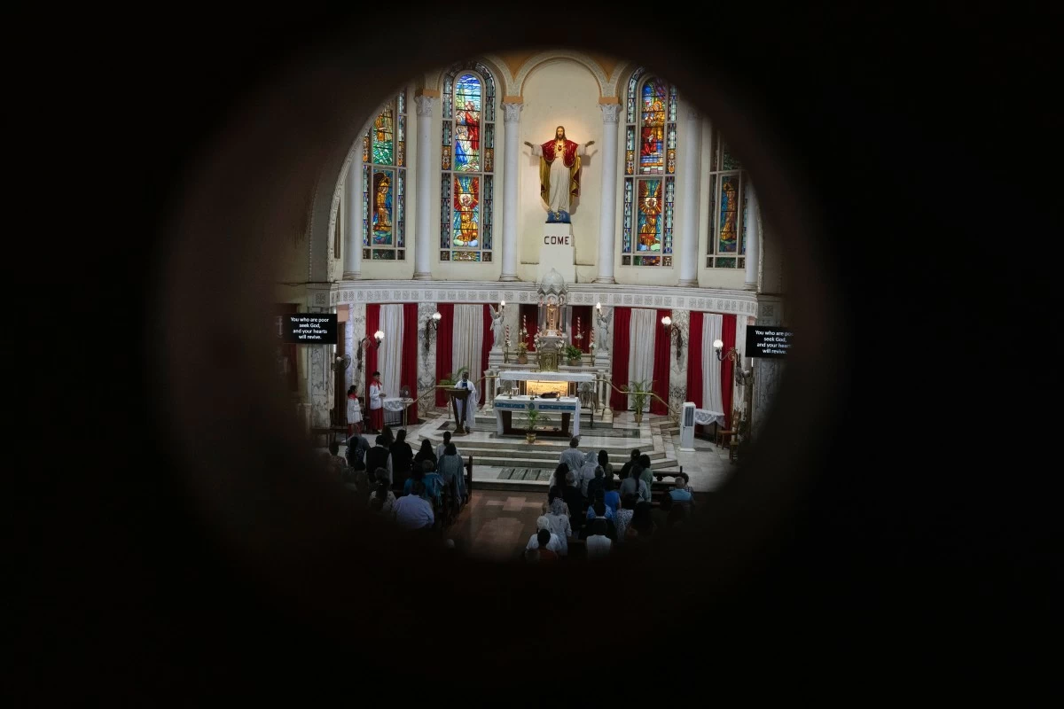 PEOPLE offer prayers for crew members of the Air India flight that crashed in Ahmedabad last month during a prayer meeting in a church in Mumbai, India, Saturday, July 12, 2025. (AP)