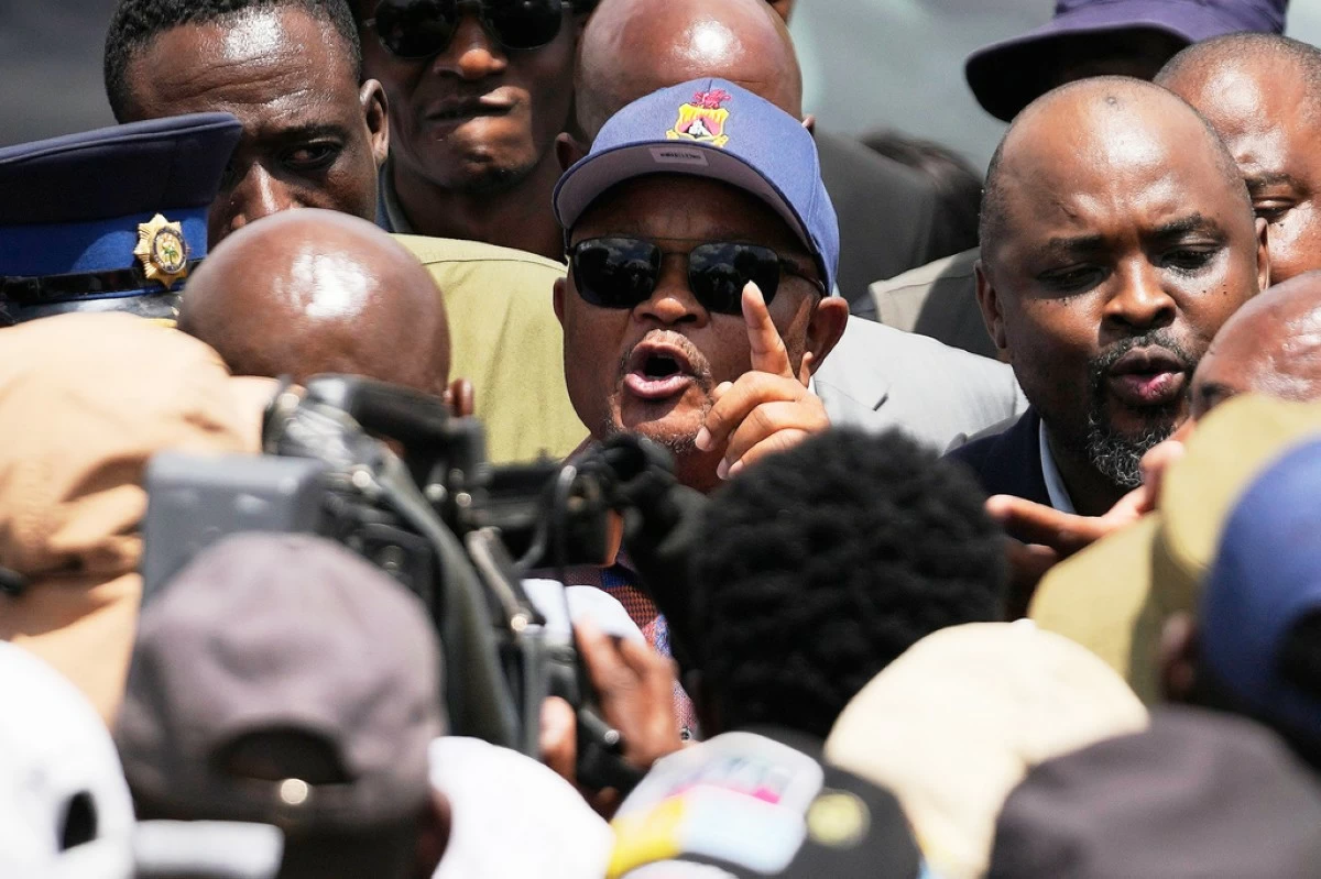 FILE - South Africa's Police Minister Senzo Mchunu, center, visits an abandoned gold mine where miners are rescued from below ground, in Stilfontein, South Africa, Jan. 14, 2025. (AP Photo/Themba Hadebe, File)