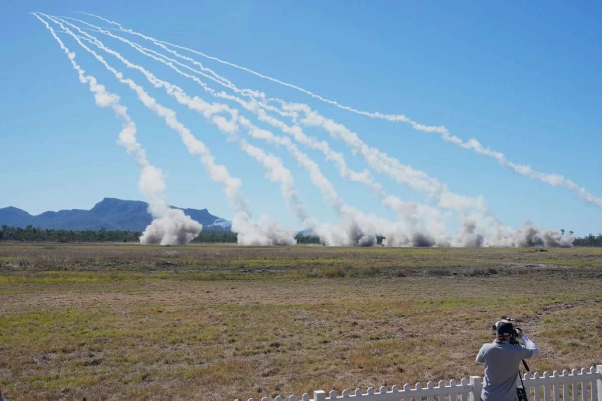 Rockets are launched from a High Mobility Artillery Rocket System during Exercise Talisman Sabre 2025, Australia's largest-ever war fighting drills at Shoalwater Bay Training Area, near Rockhampton, Australia, Monday, July 14, 2025. (AP Photo/Rick Rycroft)