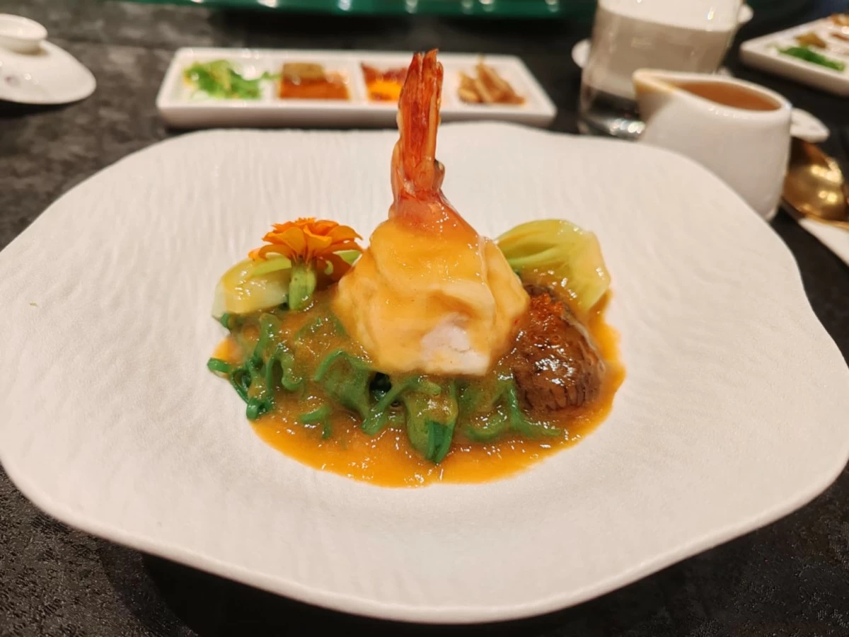 Poached Homemade Spinach Noodle in Aromatic Szechuan Seafood Broth Tiger Prawn Stuffed with Prawn Mousse