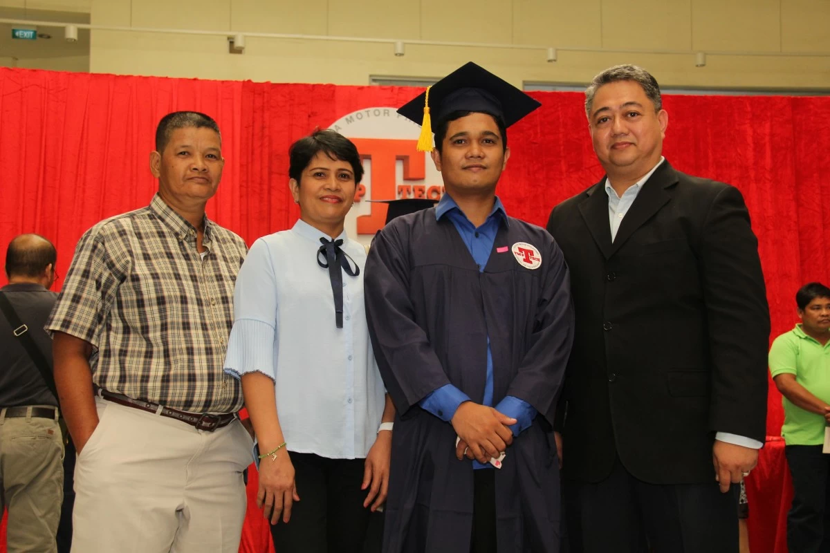 Romel Pajarito (3rd from left) graduates from TMP Tech.