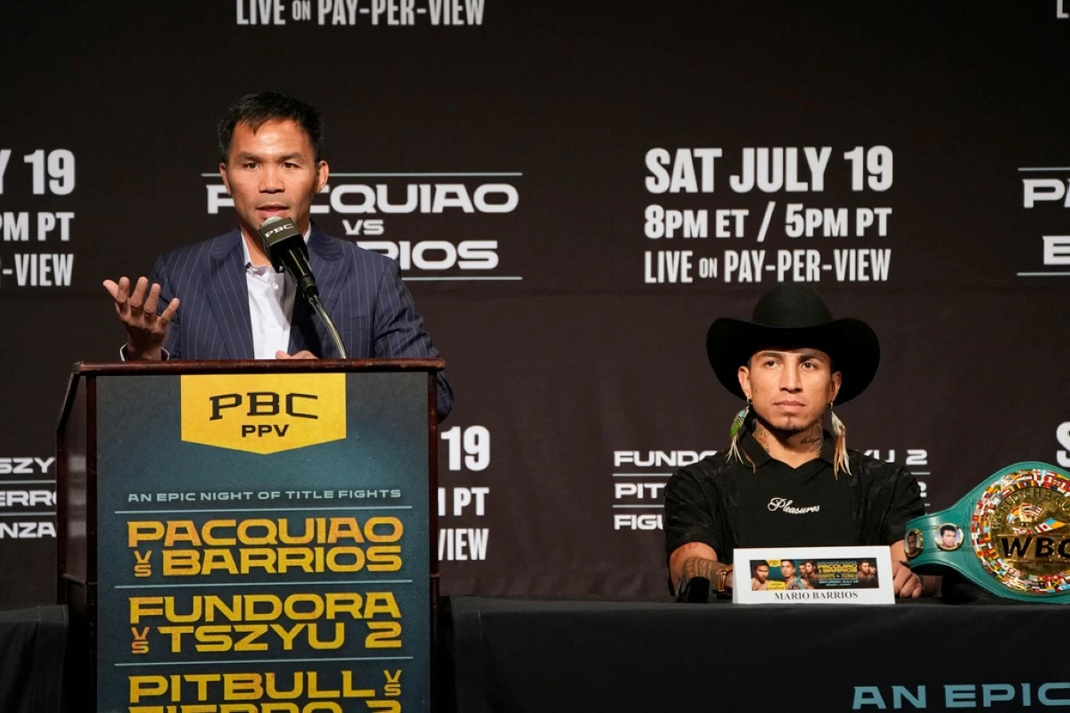 Manny Pacquiao, left, speaks beside WBC welterweight champion Mario Barrios at a news conference Wednesday, July 16, 2025, in Las Vegas. (AP Photo/John Locher)