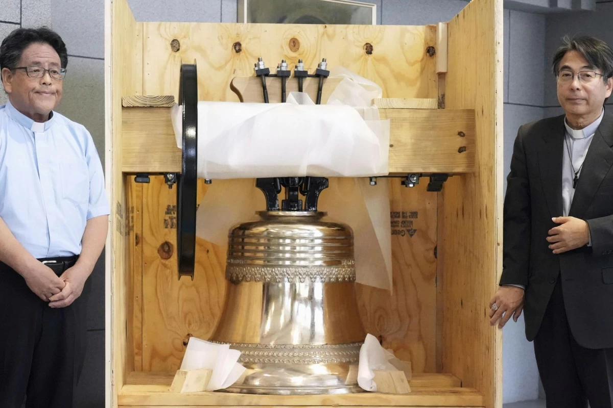 The bell, which was reproduced and returned by a group of Americans, is shown to the media at the Urakami Cathedral, nearly 80 years after the cathedral was destroyed by the U.S. atomic bombing near the end of World War, in Nagasaki, western Japan, on May 15, 2025. (Kyodo News via AP)