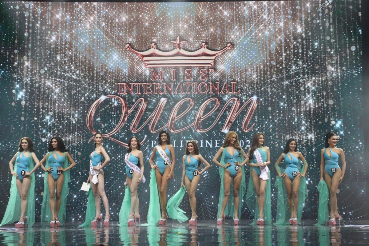 The top 10 Miss International queens pose with confidence as they take on the swimwear competition.