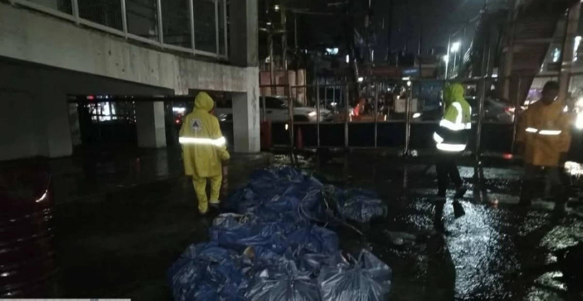 Authorities remove the construction debris near one of the MRT 7 stations in Quezon City. (photo: QC Government Facebook)