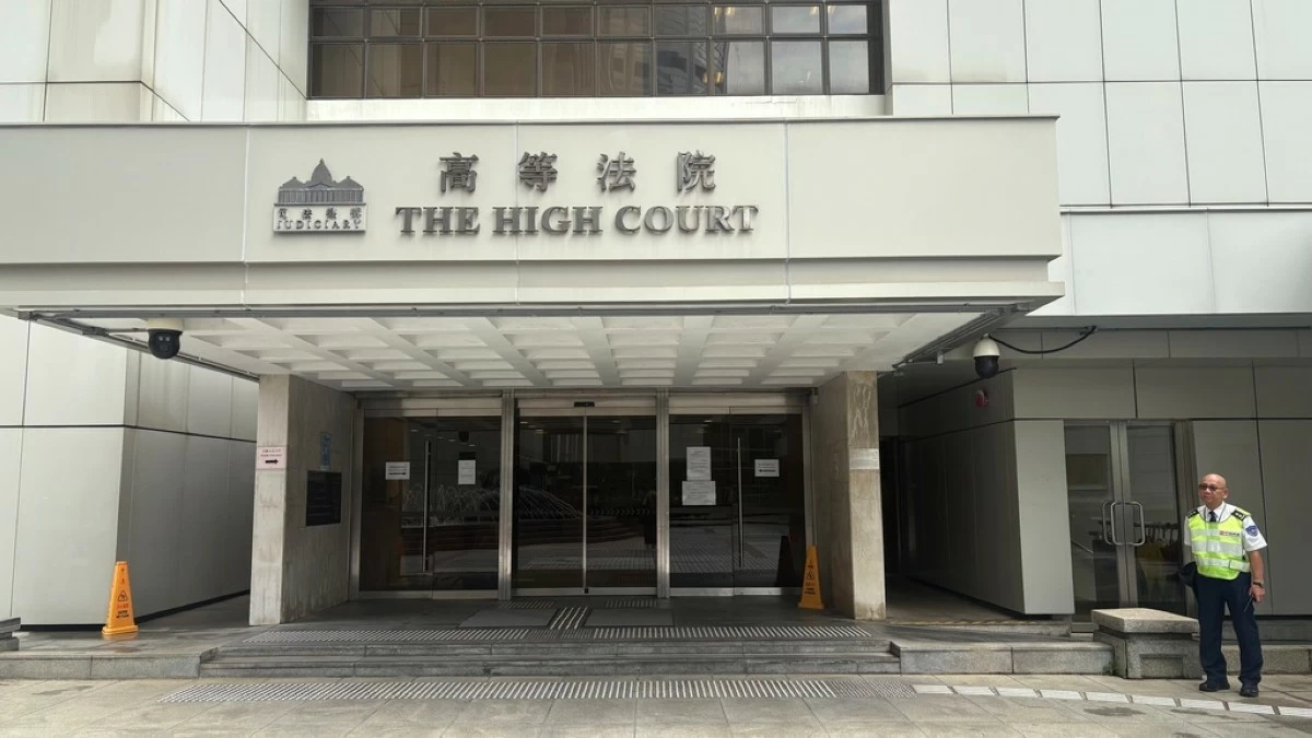 A security guard stands outside of Hong Kong's High Court in Admiralty, Hong Kong Wednesday, July 23, 2025. (AP Photo/Kanis Leung)