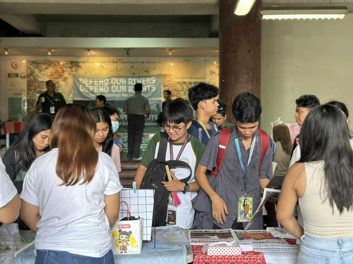 Booths outside the forum carry products that promote their advocacies.
