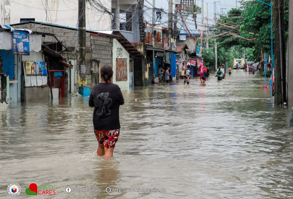 Flooded residential area in Kawit, a municipality which also lies along the coast of Cavite (Photo from Rep. Jolo Revilla's Facebook page/MANILA BULLETIN)
