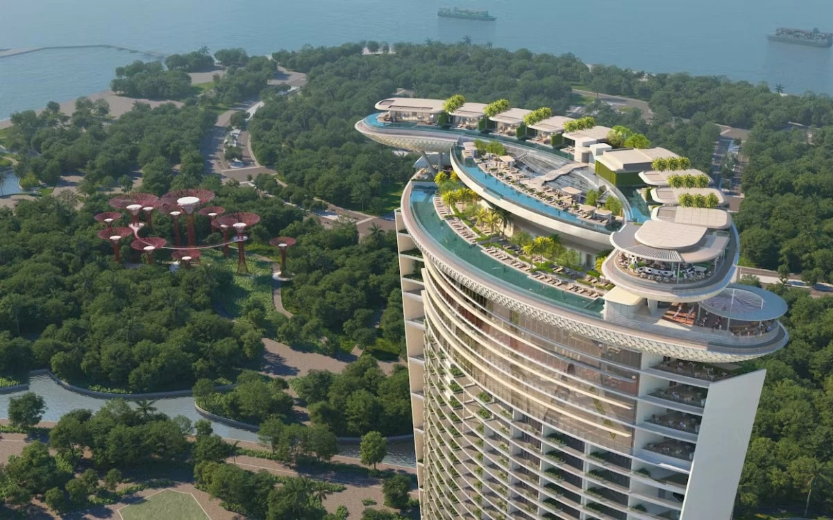 The 55-story hotel tower will rise at a 45-degree angle, with twin wings curving outward to frame views of Marina Bay and the Singapore Strait. (Photo from Safdie Architects/Website)