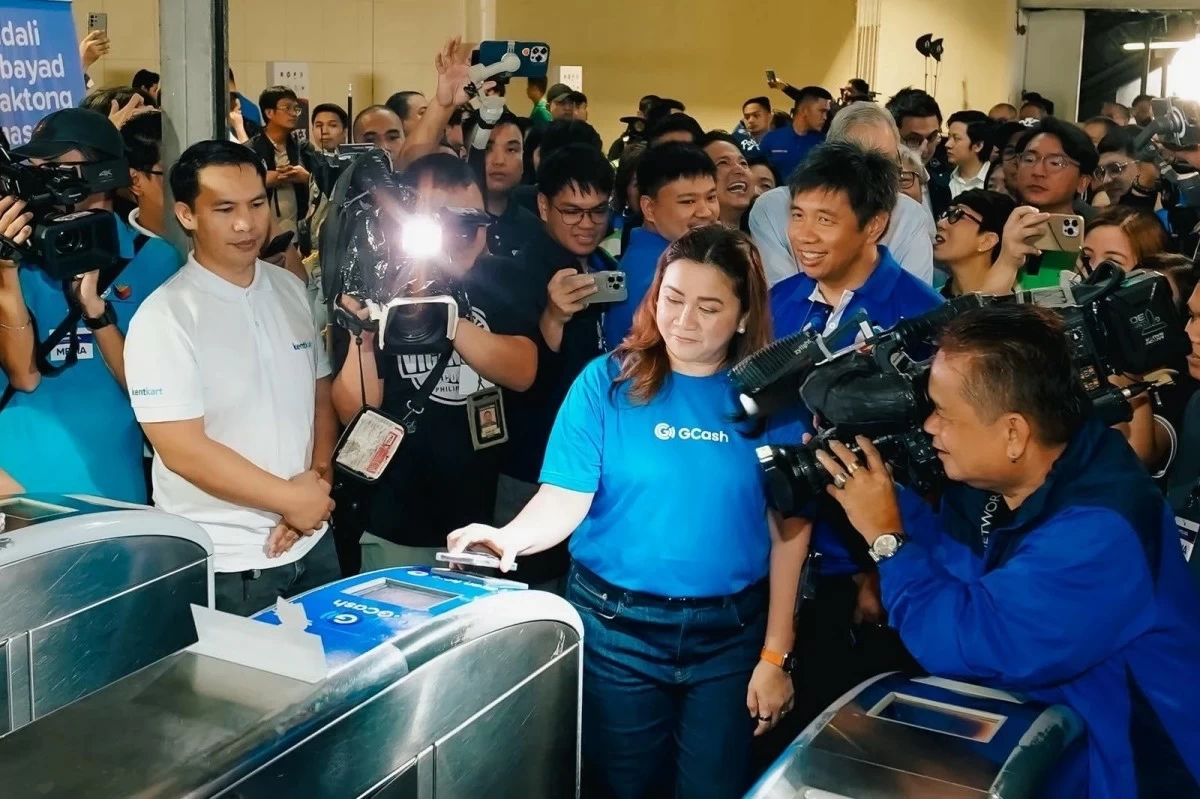 Martha Sazon, President and CEO of GCash holding company Mynt, tests out one of the digital payment options powered by GCash at the MRT-3 Ayala station on July 25. The Philippines’ leading finance super app is targeting to roll out these digital payment options to other modes of transportation in the future, accelerating the digital transformation of the system for faster, easier commutes.