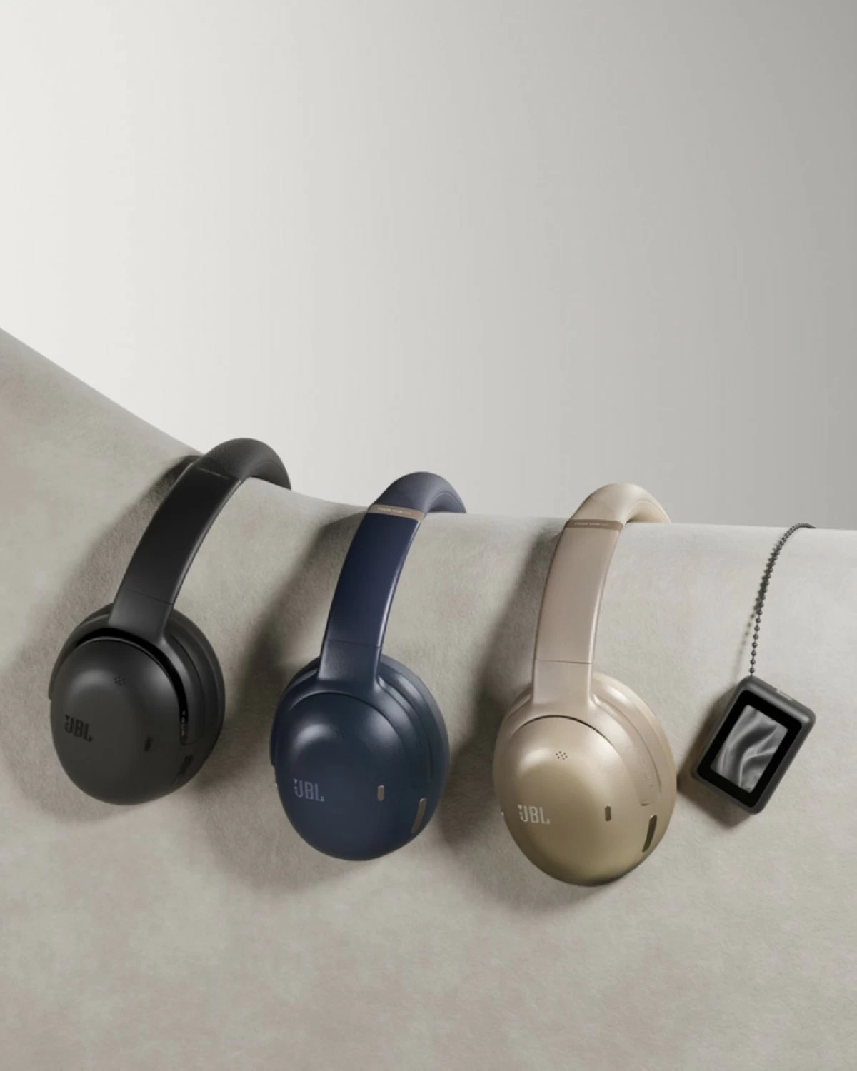 The JBL Tour One M3 Smart TX comes in black, latte, and blue.