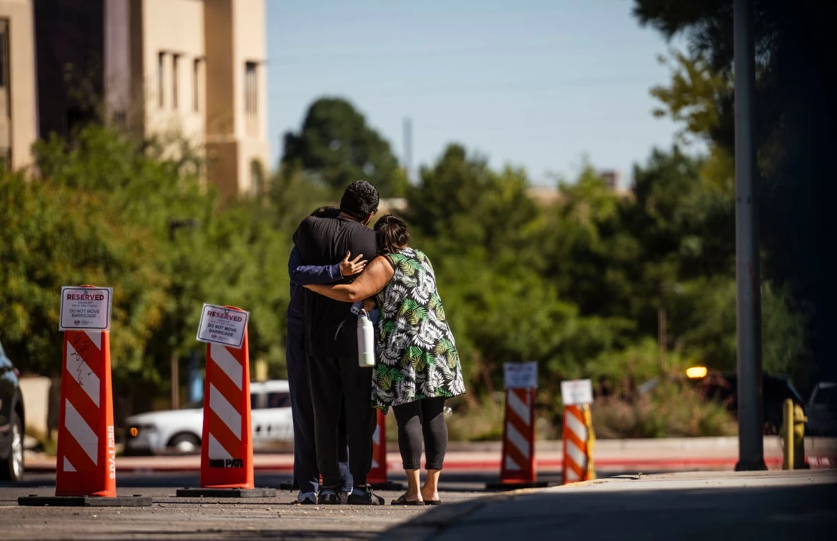 FAMILY members embrace at the University of New Mexico Central Campus after a deadly shooting at Casas del Rio (Gila), a student housing center, early Friday, July 25, 2025 in Albuquerque, New Mexico.  (AP)