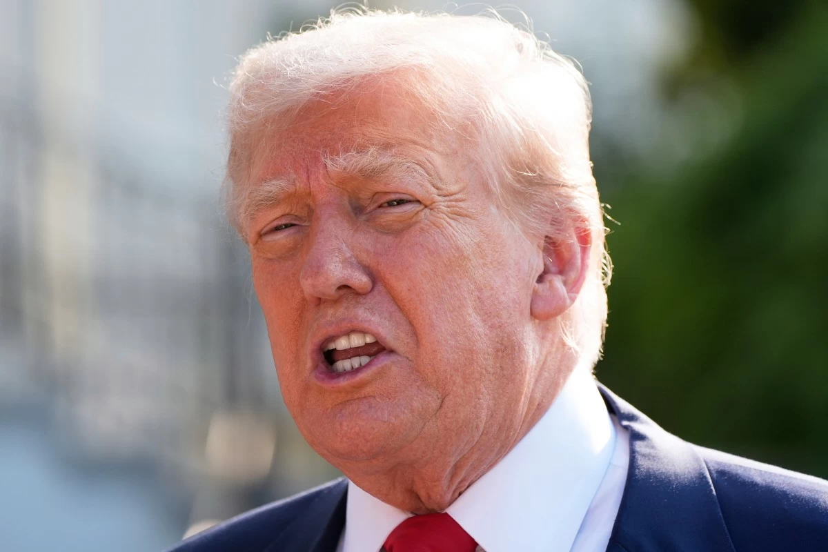 President Donald Trump speaks with reporters before departing on Marine One from the South Lawn of the White House, Friday, July 25, 2025, in Washington. The President is traveling to Scotland. (AP Photo/Alex Brandon)